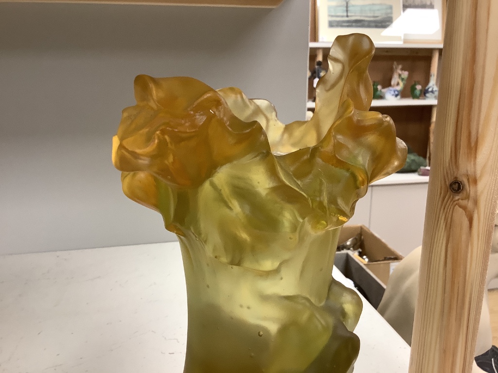 An amber vase with a nude study in relief, apocryphal Daum mark, 24cm high